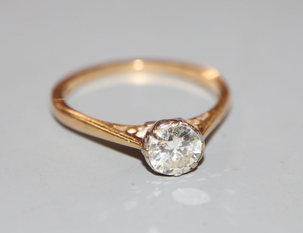 An 18ct and solitaire diamond ring, size N, gross 2.5 grams.